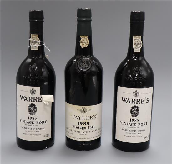 A bottle of Taylors Vintage Port 1985 and two bottles of Warres vintage port 1985